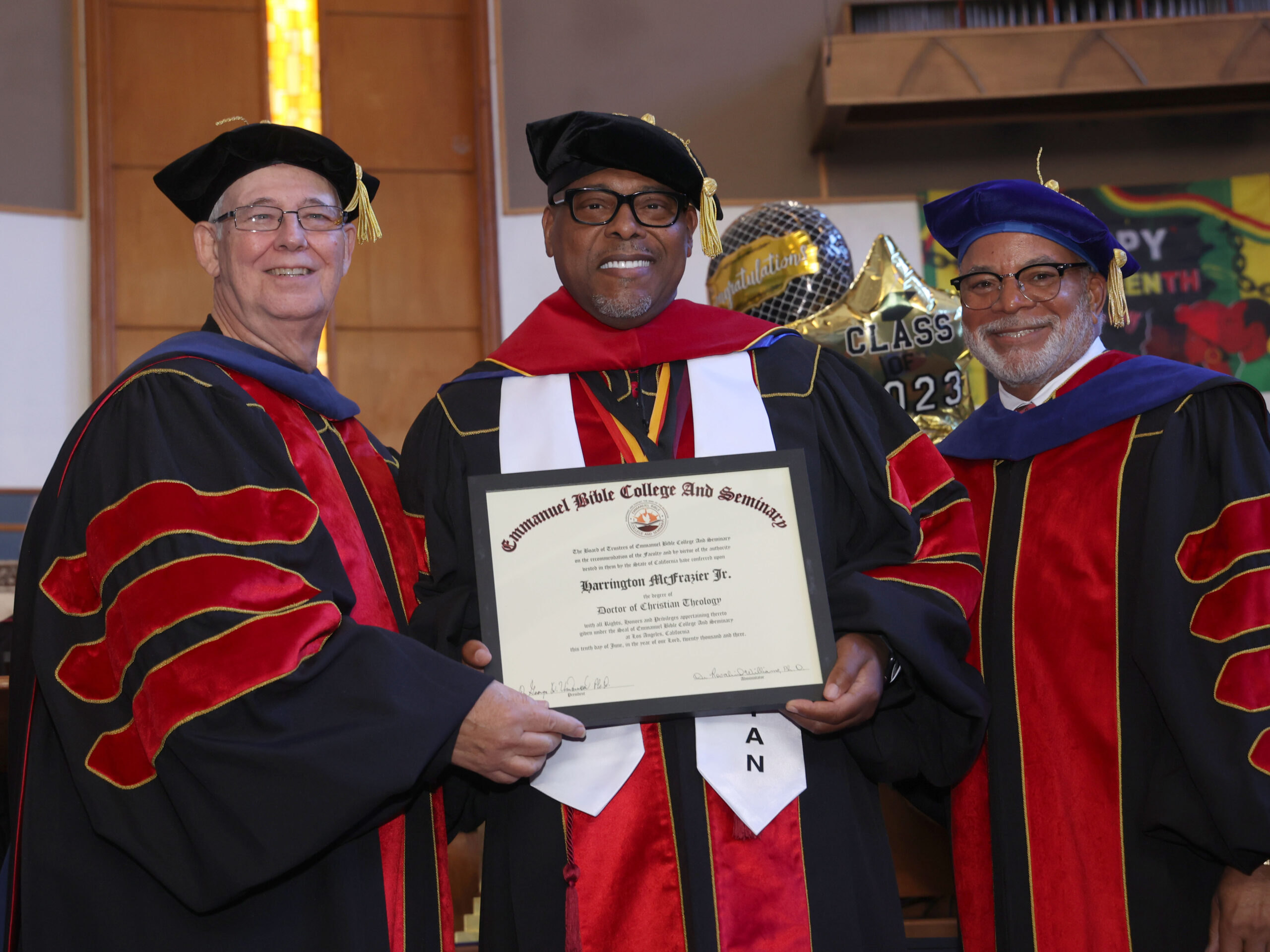 dr underwood and teacher pictured with graduate